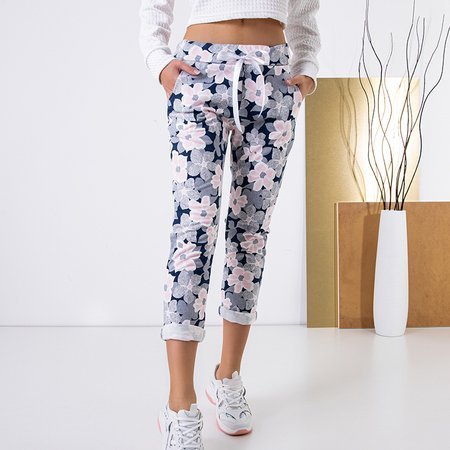 Navy blue women's pants with a pink floral pattern - Clothing