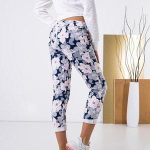 Navy blue women's pants with a pink floral pattern - Clothing
