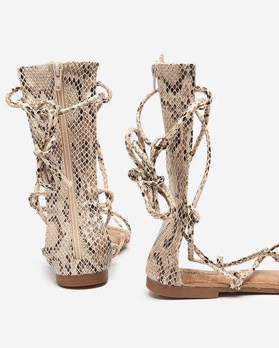Calf-length gladiator sandals with Yenise beige embossing - Footwear