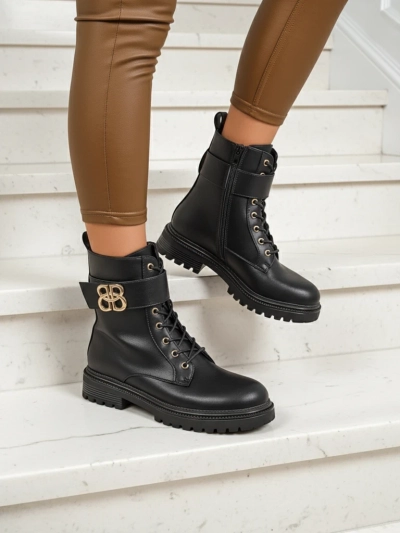 Artemisia Nero leather ankle boots with a round toe, zipper, and gold buckle