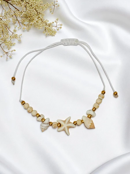 Sieviešu aproce ar gliemežvāku Marina Belle