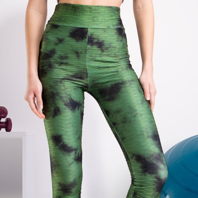 Green women's leggings with decorative spots - Clothing
