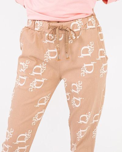 Ladies' beige fabric trousers with inscriptions - Clothing