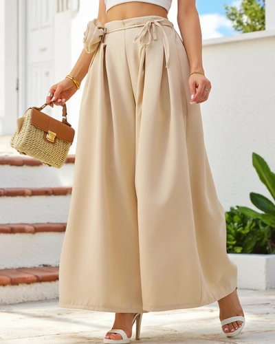 Royalfashion Elegant wide women's trousers with a decorative flower at the waist