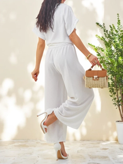 Royalfashion Женский комплект с завязанной короткос sleevesрубашкой и расклешенными брюками с стразами