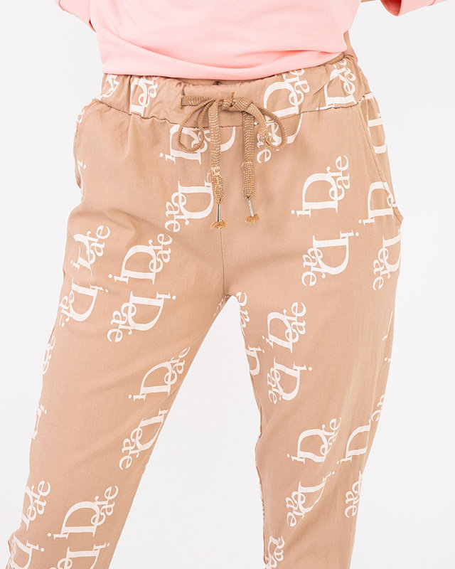 Ladies' beige fabric trousers with inscriptions - Clothing