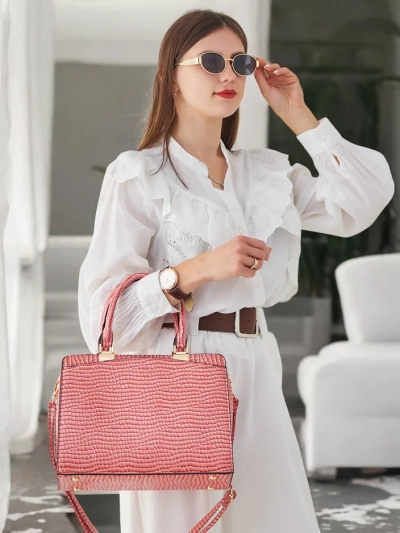 Royalfashion Elegant women's handbag made of patent leather with embossing