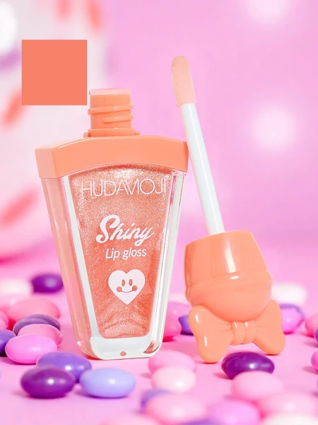 Spīdumu saturoša lūpu spīduma krāsa Coral