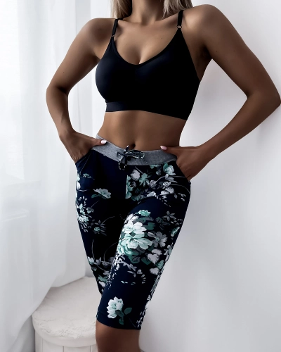 Sieviešu 3/4 tumši zili šorti ar zaļiem ziediem PLUS IZMĒRS - Apģērbs