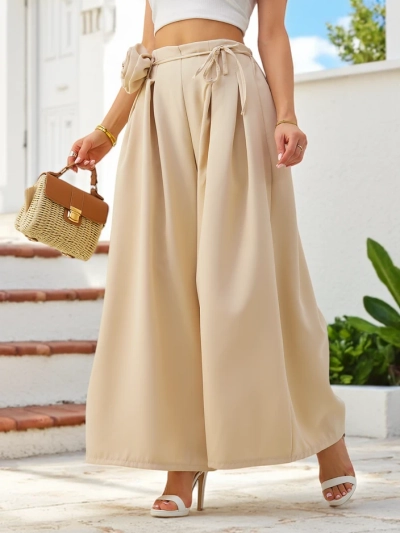 Royalfashion Elegant wide women's trousers with a decorative flower at the waist