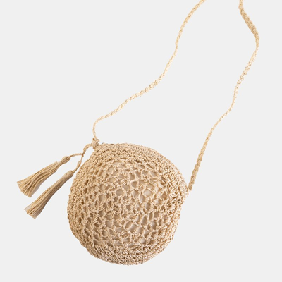 Small round handbag made of beige braided straw - Handbags