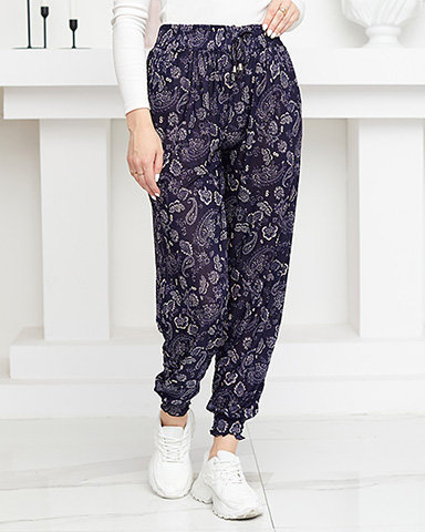 Beige and navy blue women's trousers with print - Clothing