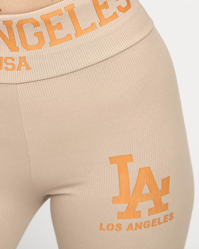 Light brown women's striped leggings with orange inscriptions - Clothing