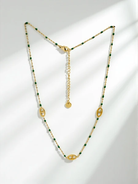 Aurelia Verde Necklace – Gold Greca Links with Green Stones