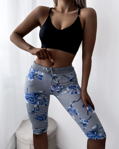 Pelēki sieviešu 3/4 garuma šorti ar ziedu rakstu - Apģērbs