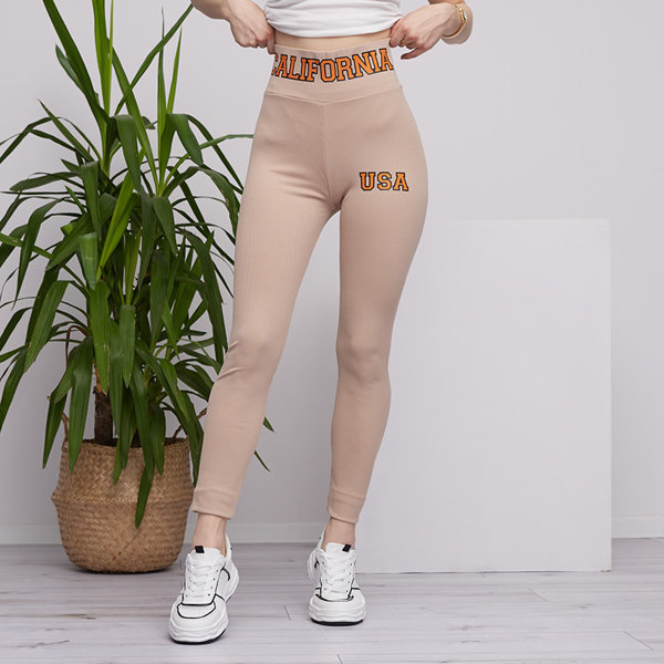 Beige women's striped leggings with orange inscriptions - Clothing