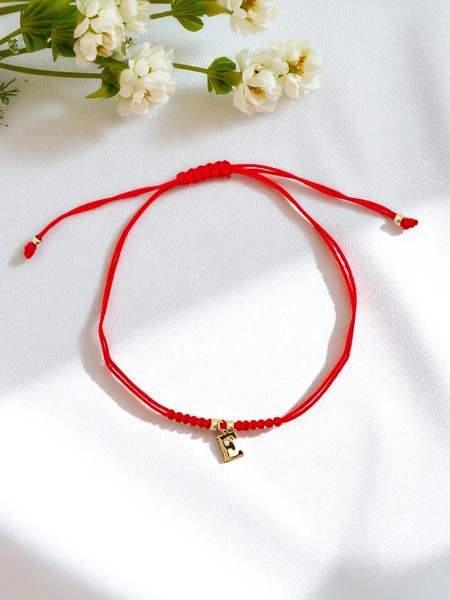 Sieviešu aproce ar burtu E