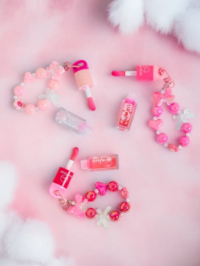 Lip gloss for children with bracelet Colorless