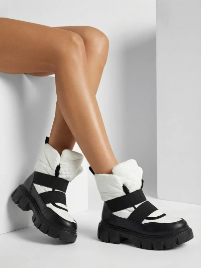 Sieviešu sniega zābaki ar plakanu zoli melnā un baltā krāsā Ferory- Footwear