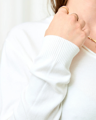 Royalfashion White women's sweater with heart neckline