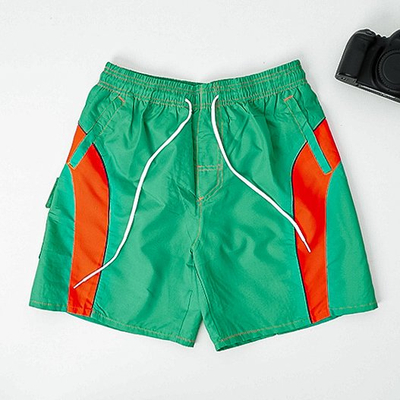 Men's green sports shorts with orange inserts - Clothing