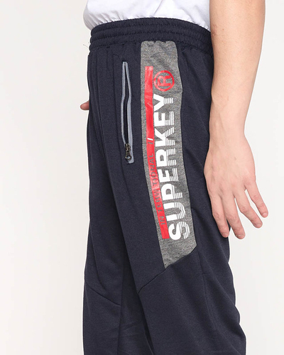 Navy blue men's sweatpants with inscriptions - Clothing