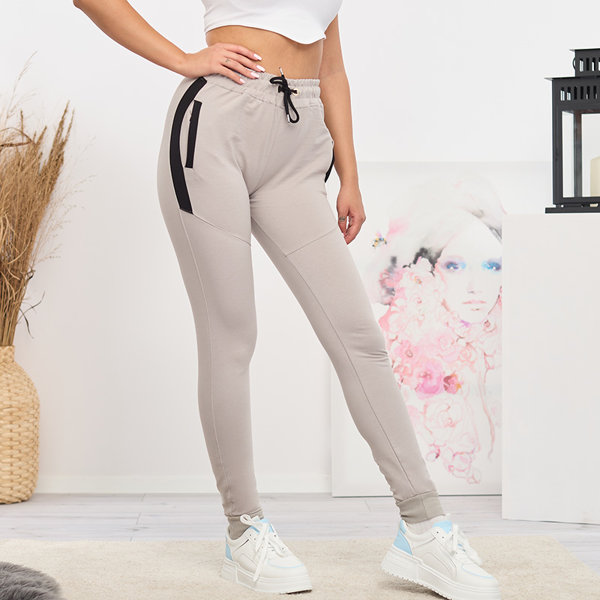 Sieviešu gaiši pelēkas treniņbikses ar ieliktņiem- Apģērbs