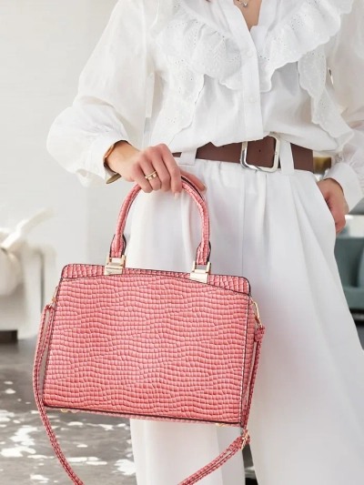 Royalfashion Elegant women's handbag made of patent leather with embossing