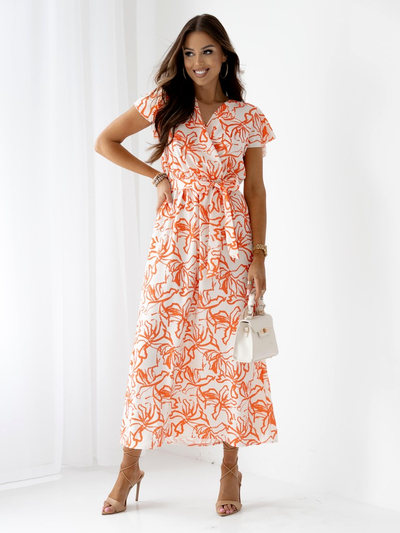 Royalfashion Patterned Women's midi dress with short sleeves, a wrap neckline, and a belt