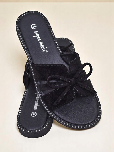 Women's flat slide sandals with a bow.