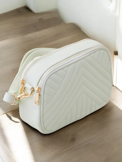 Royalfashion Small oval women's handbag made of quilted eco-leather