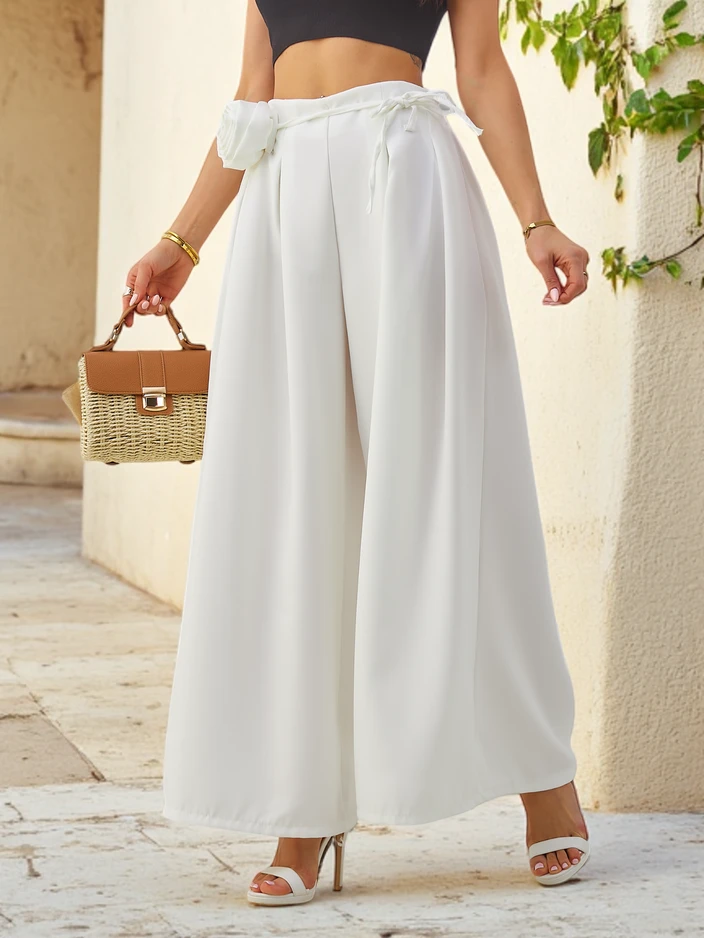 Royalfashion Elegant wide women's trousers with a decorative flower by the belt