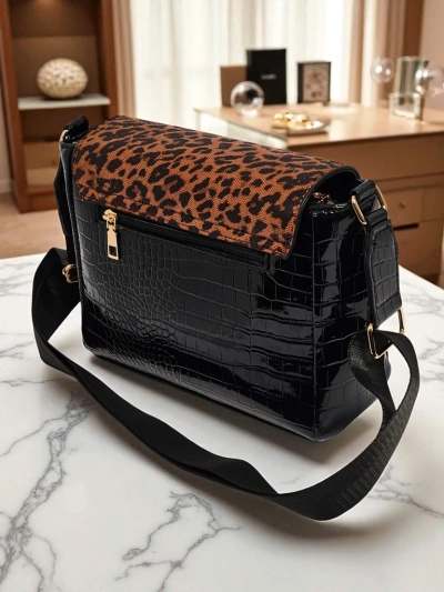 Athena Nero - stylish women's patent handbag with panther
