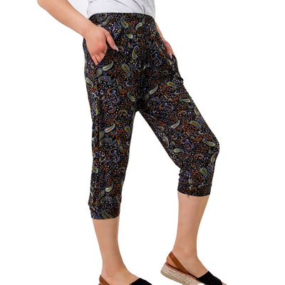 Black women's shorts with green floral print PLUS SIZE - Clothing