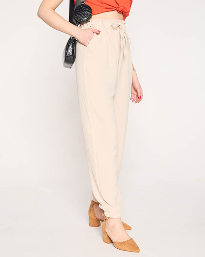 Sieviešu auduma bikses bēšā krāsā PLUS IZMĒRS - Apģērbs