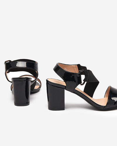 Black lacquered women's sandals on the Wopala post - Footwear