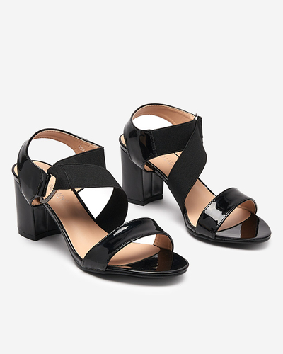 Black lacquered women's sandals on the Wopala post - Footwear
