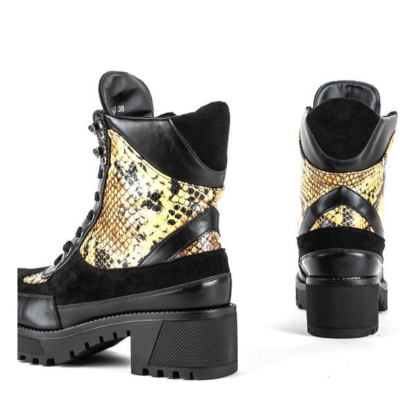 Black snakeskin imitation bags on a pole - Footwear