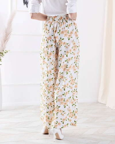 Женские белые брюки из ткани с цветочным рисунком - Одежда
