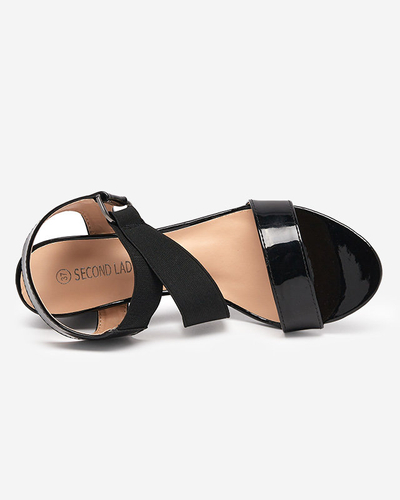 Black lacquered women's sandals on the Wopala post - Footwear