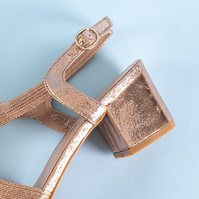 Gold women's sandals on a Madurai post - Footwear