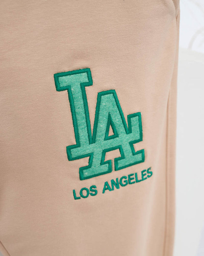 Women's beige sweatpants with a colored patch - Clothing