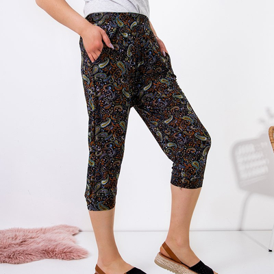 Black women's shorts with green floral print PLUS SIZE - Clothing