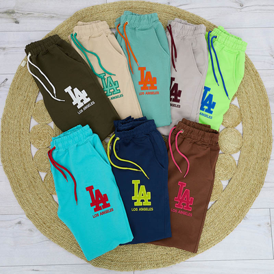 Women's beige sweatpants with a colored patch - Clothing