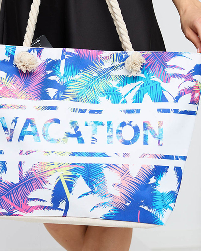 Blue beach bag with floral print - Accessories