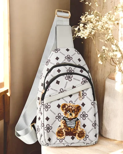 Royalfashion Small women's eco-leather backpack with a bear on one shoulder