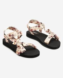 OUTLET Sieviešu melnas sandales ar smilškrāsas ziedu svītrām - Apavi